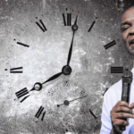 image of apostle joshua selman with a clock indicative of change in times and seasons