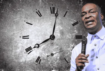 image of apostle joshua selman with a clock indicative of change in times and seasons