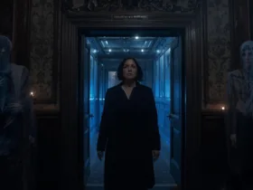 A WOMAN WALKING IN A ROOM AND BEING MONITORED BY SPIRITS